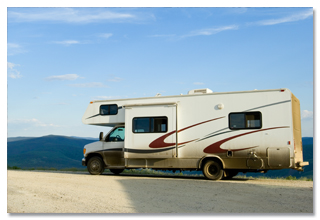 An RV stopped on a dirt road